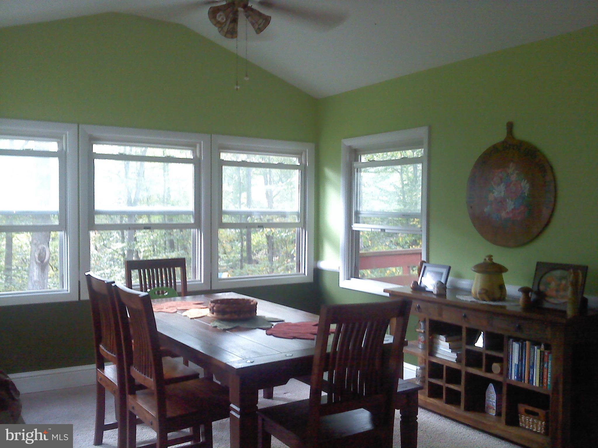 75 Walton Road Huntingtown, MD 20639 - Photo 4 of 12 Dining room off kitchen with cathedral ceilings