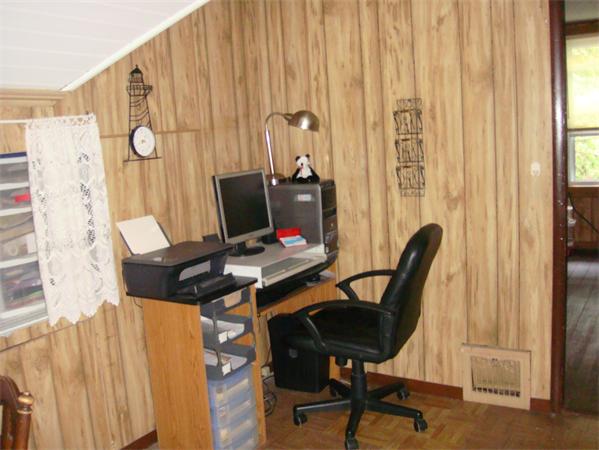 266 Nottingham Street Springfield, MA 01104 - Photo 13 of 13 a view of a workspace with furniture and a window