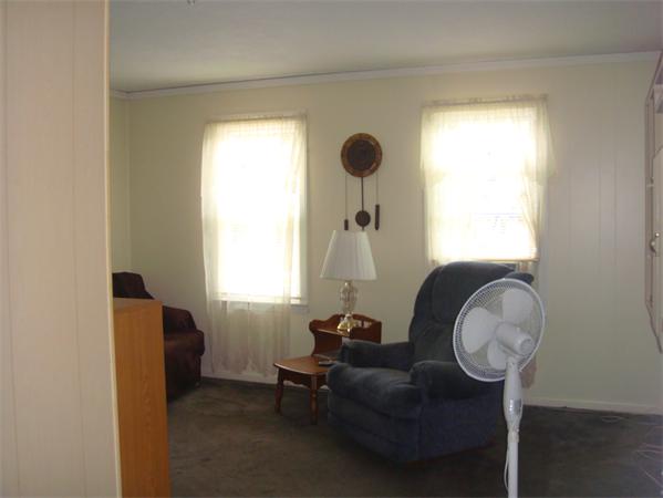 266 Nottingham Street Springfield, MA 01104 - Photo 8 of 13 a living room with furniture and a window