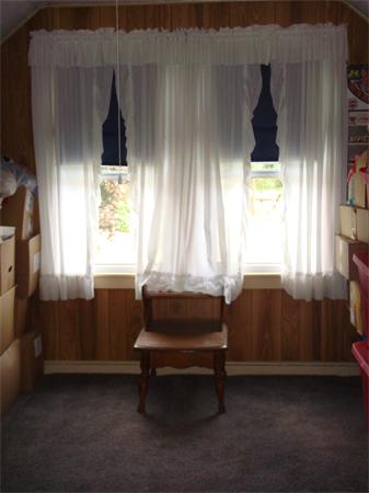 266 Nottingham Street Springfield, MA 01104 - Photo 10 of 13 a bedroom with a bed and a window