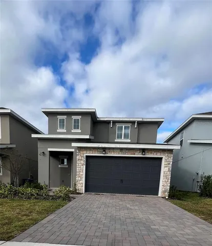 a front view of a house with yard