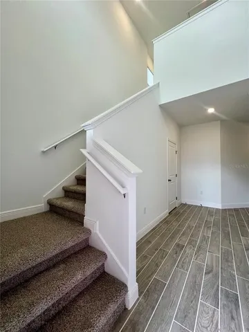 a view of an empty room with stairs