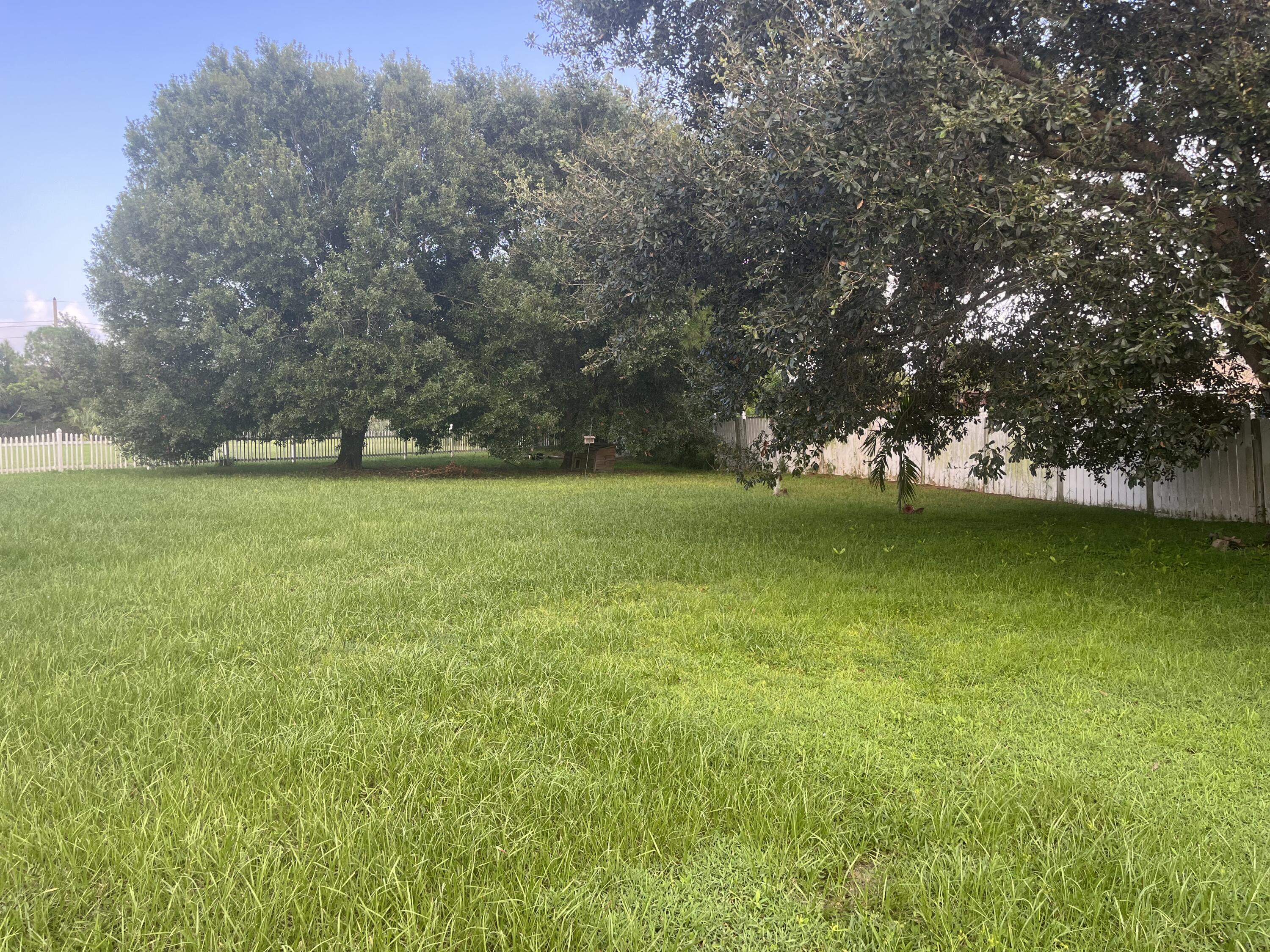 702 Southwest Amber Terrace Port St. Lucie, FL 34953 - Photo 15 of 16 a view of a green field with clear sky