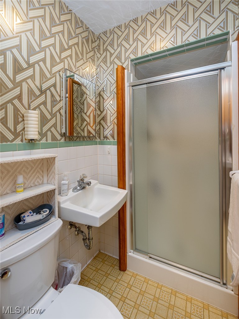 750 Sagamore Road Northfield, OH 44067 - Photo 19 of 37 Bathroom featuring toilet, enclosed shower, and sink