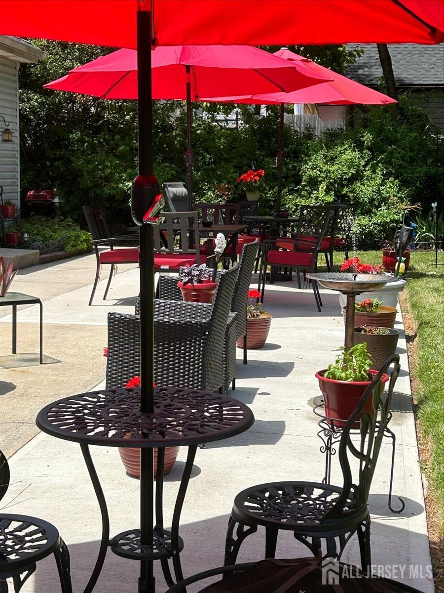 33 Ellison Road Somerset, NJ 08873 - Photo 25 of 38 a view of a patio with a table and chairs