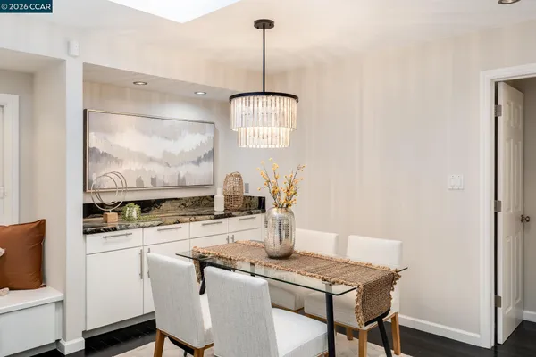 a kitchen with a table and chairs in it