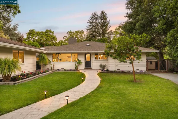 a view of a house with a yard porch and sitting area