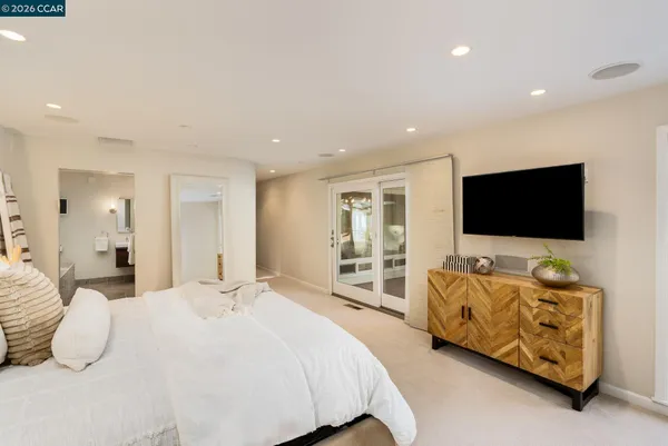 a bedroom with bed and walk in closet