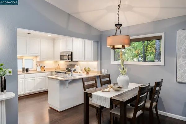 a bedroom with bed and night stand