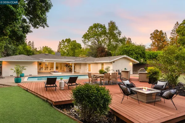 a patio with patio a couch and chairs