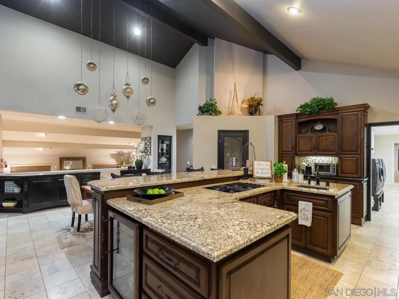 11630 Shadowglen Road El Cajon, CA 92020 - Photo 12 of 64 a kitchen with a stove a kitchen island a sink and a refrigerator