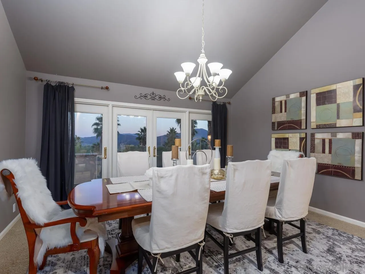 11630 Shadowglen Road El Cajon, CA 92020 - Photo 16 of 64 a view of a dining room with furniture a chandelier and wooden floor