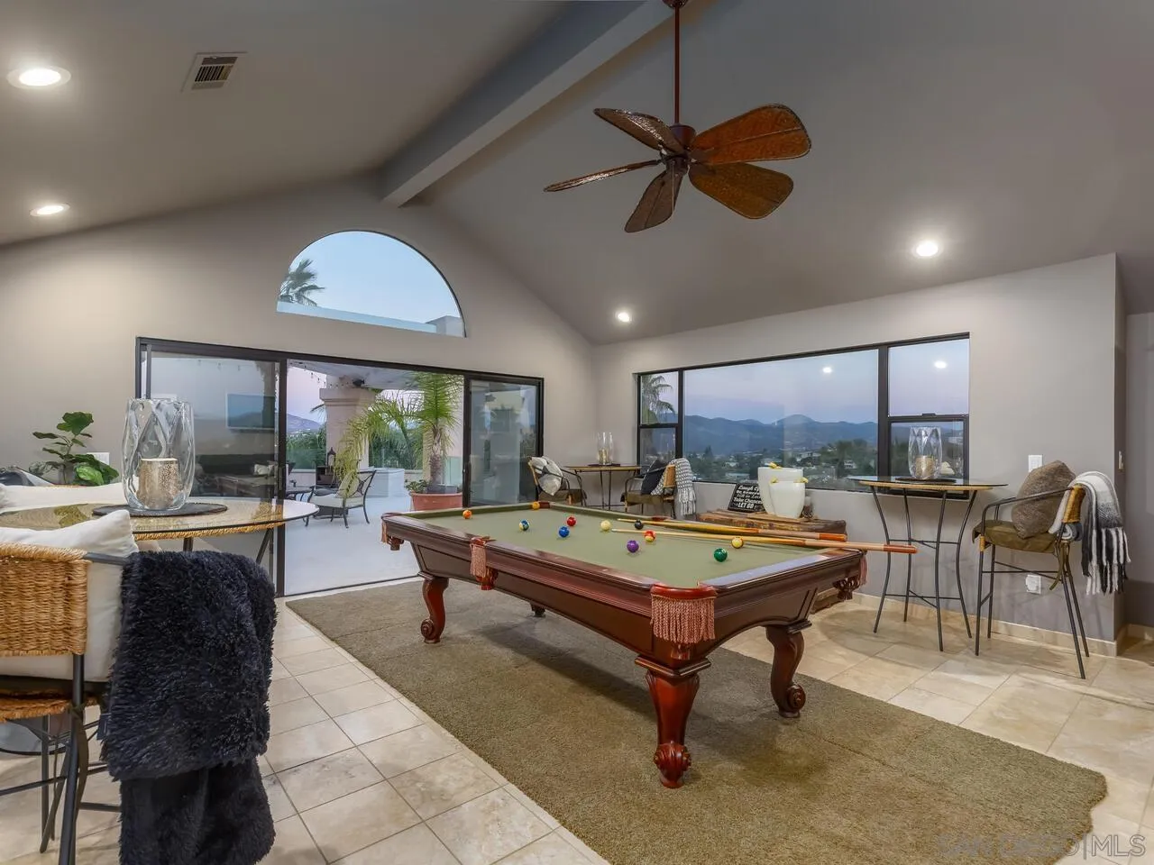 11630 Shadowglen Road El Cajon, CA 92020 - Photo 22 of 64 a living room with furniture a table and a large window
