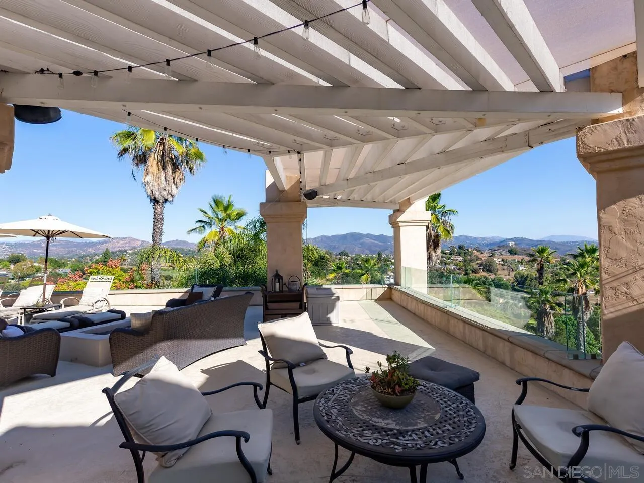 11630 Shadowglen Road El Cajon, CA 92020 - Photo 24 of 64 a living room with patio furniture and a potted plant