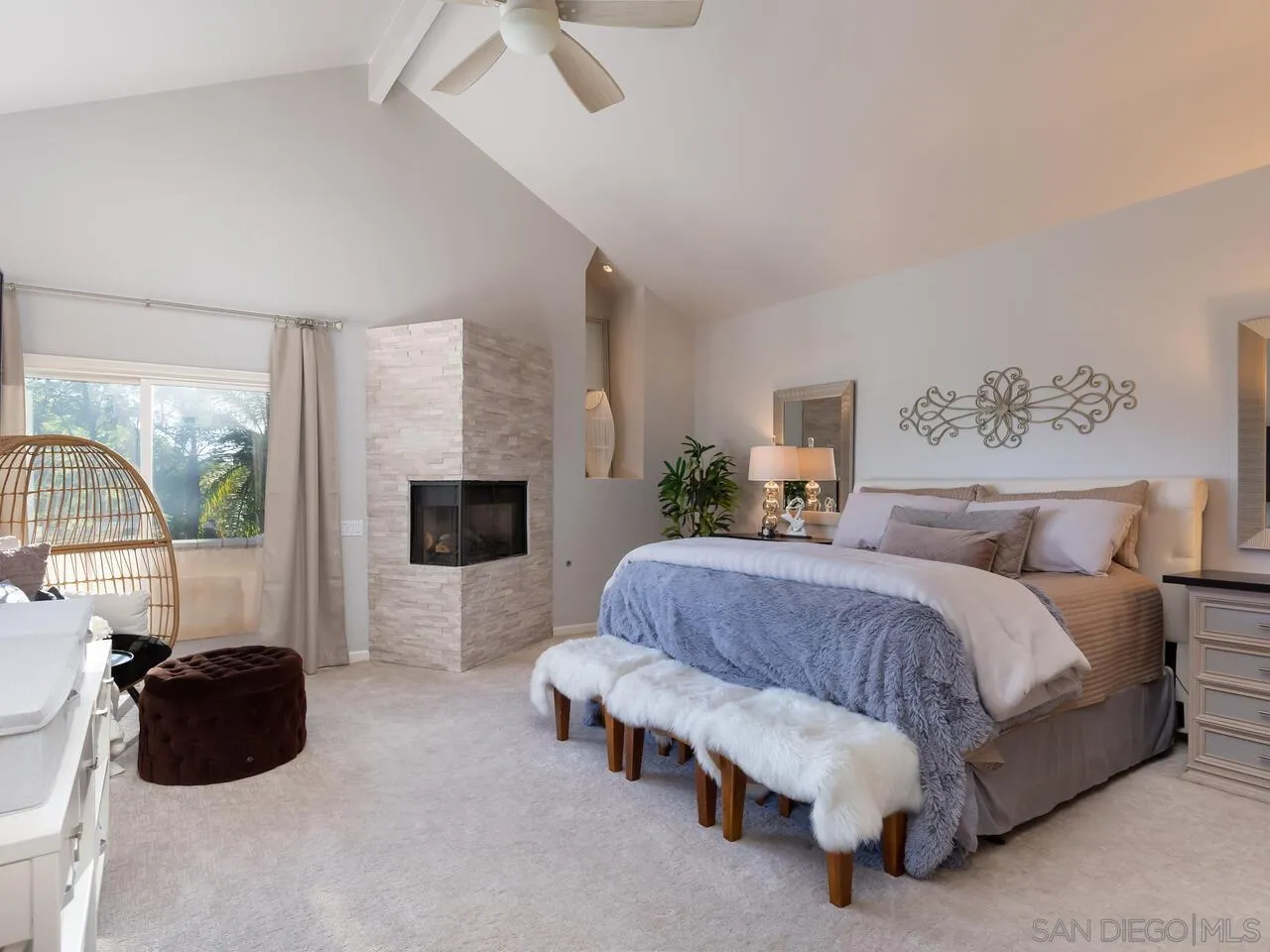 11630 Shadowglen Road El Cajon, CA 92020 - Photo 32 of 64 a spacious bedroom with a bed a couch and a flat tv screen