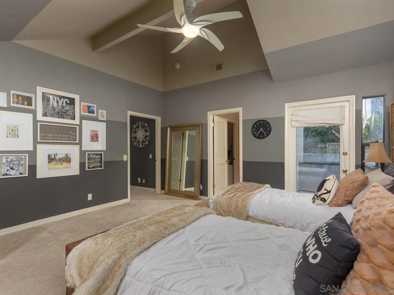 11630 Shadowglen Road El Cajon, CA 92020 - Photo 38 of 64 a bedroom with a large bed and a chandelier