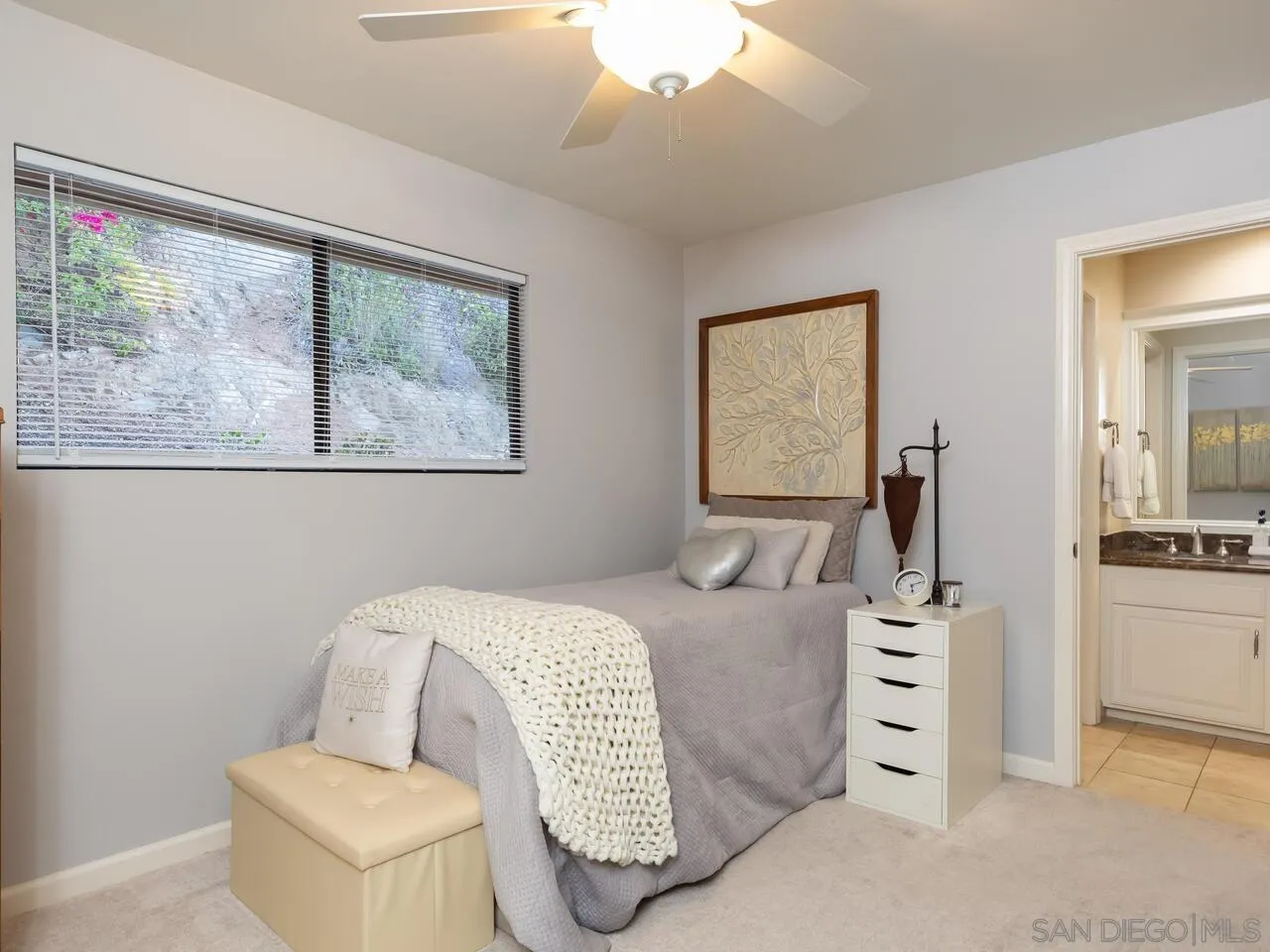 11630 Shadowglen Road El Cajon, CA 92020 - Photo 40 of 64 a bedroom with a bed and a painting on the wall