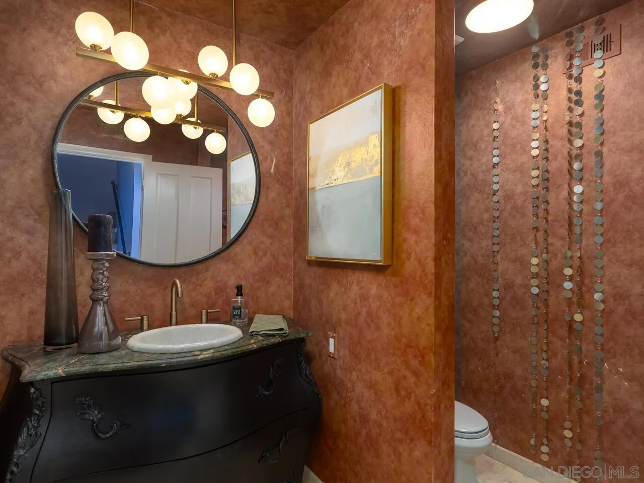 11630 Shadowglen Road El Cajon, CA 92020 - Photo 41 of 64 a bathroom with a sink vanity and a mirror