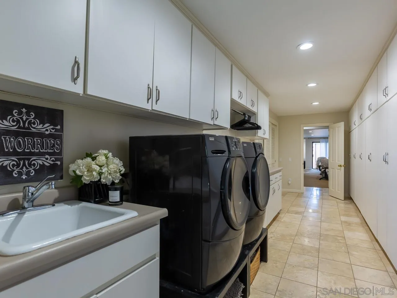 11630 Shadowglen Road El Cajon, CA 92020 - Photo 44 of 64 a utility room with dryer and washer