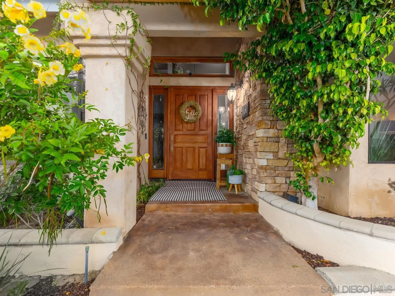 11630 Shadowglen Road El Cajon, CA 92020 - Photo 47 of 64 a front view of a house with a yard