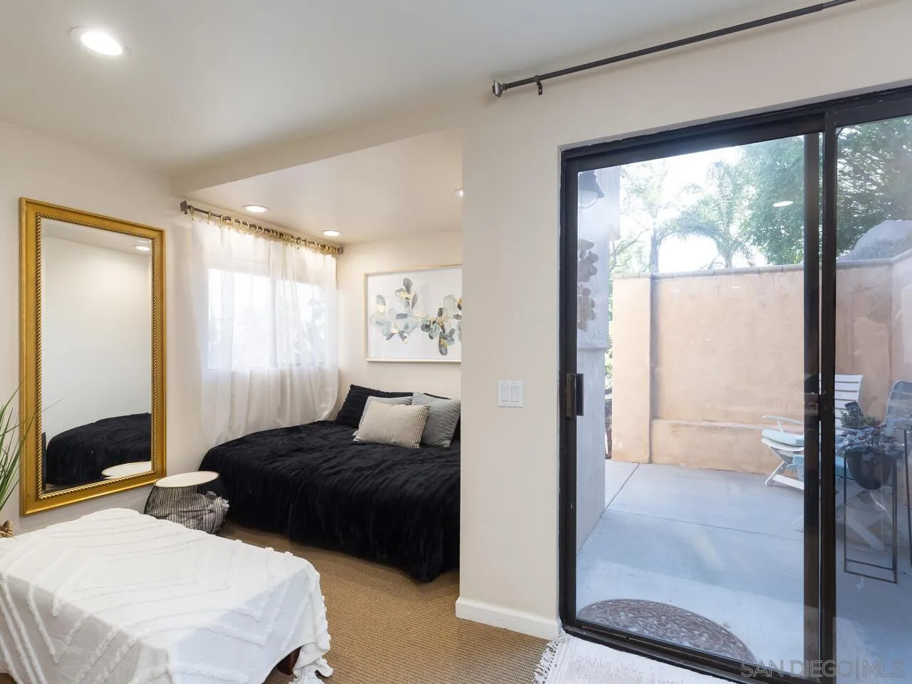 11630 Shadowglen Road El Cajon, CA 92020 - Photo 50 of 64 a bedroom with two beds and a large window