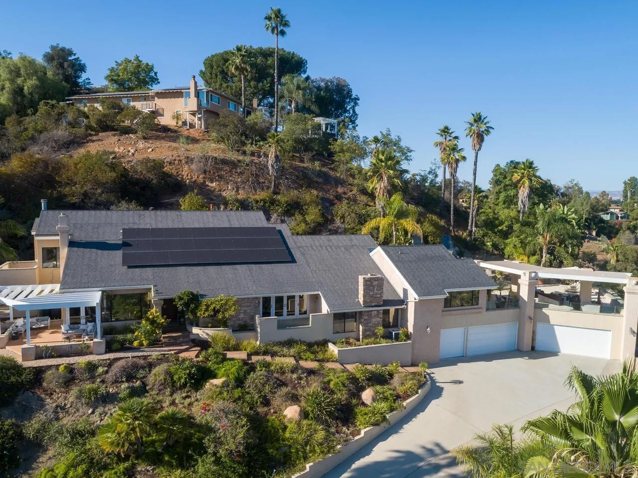 11630 Shadowglen Road El Cajon, CA 92020 - Photo 53 of 64 an aerial view of a house with a yard and potted plants