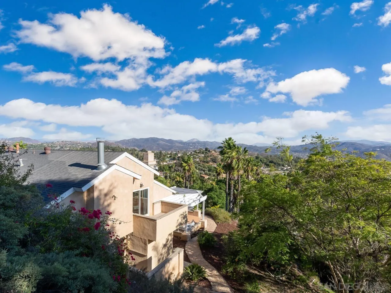 11630 Shadowglen Road El Cajon, CA 92020 - Photo 60 of 64 a view of a house with a yard and garden