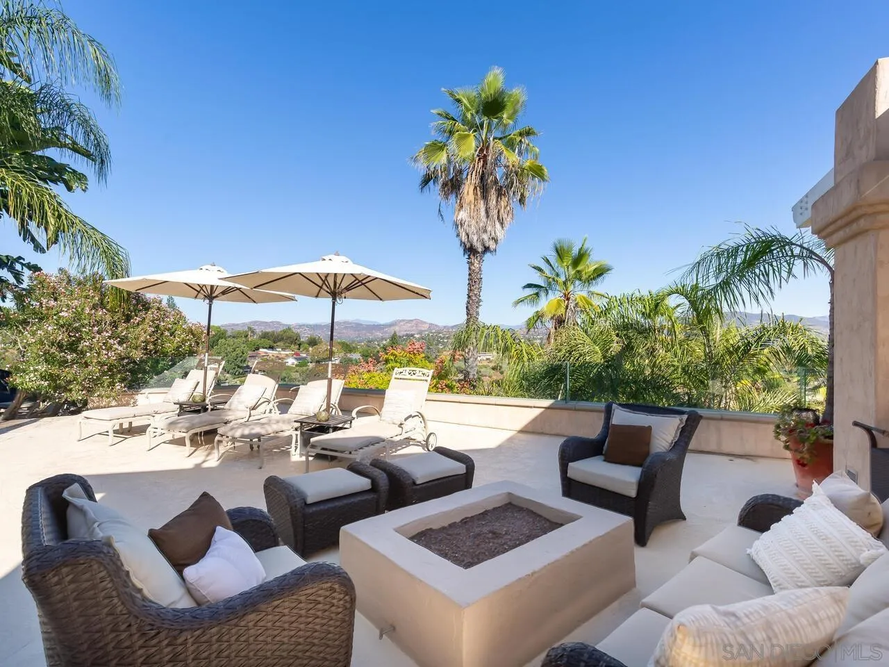11630 Shadowglen Road El Cajon, CA 92020 - Photo 63 of 64 a view of a patio with couches under an umbrella