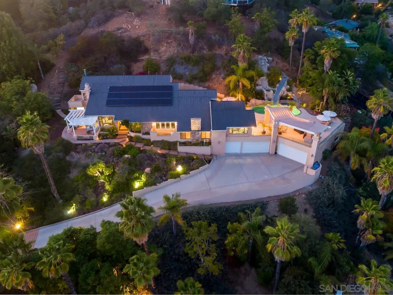 11630 Shadowglen Road El Cajon, CA 92020 - Photo 7 of 64 a view of a chairs and table in a backyard
