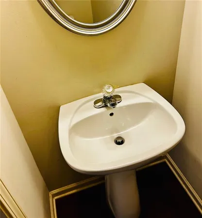 a bathroom with a sink and mirror