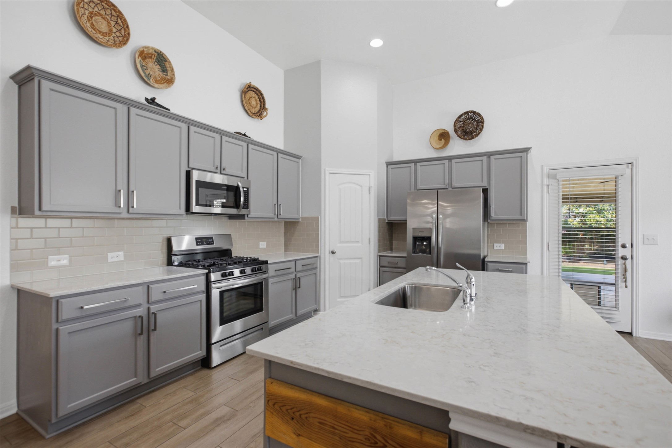 2413 Bridges Ranch Road Georgetown, TX 78628 - Photo 8 of 31 Culinary aspirations thrive in this kitchen, boasting pristine countertops, abundant cabinetry, and a full suite of stainless appliances.