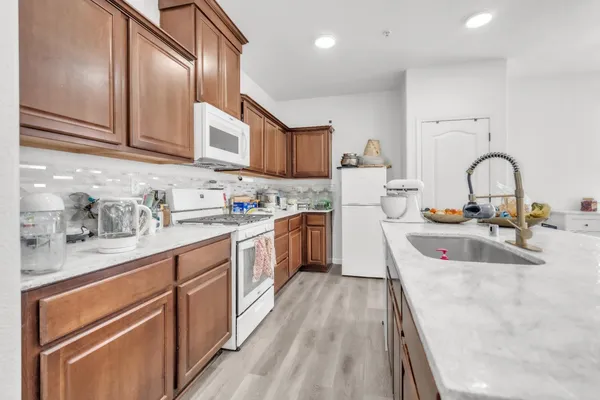 a kitchen with kitchen island granite countertop lots of counter top space