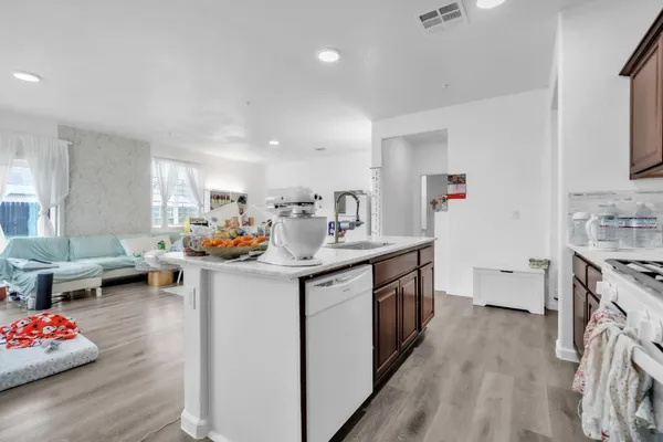a kitchen with cabinets a sink and appliances