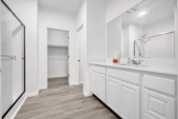 a view of a garden with a barn in the back