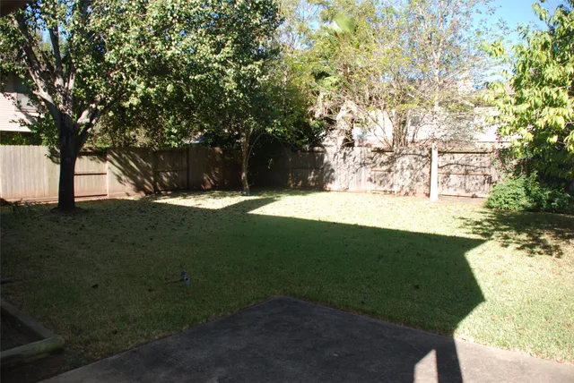 a backyard of a house with lots of green space