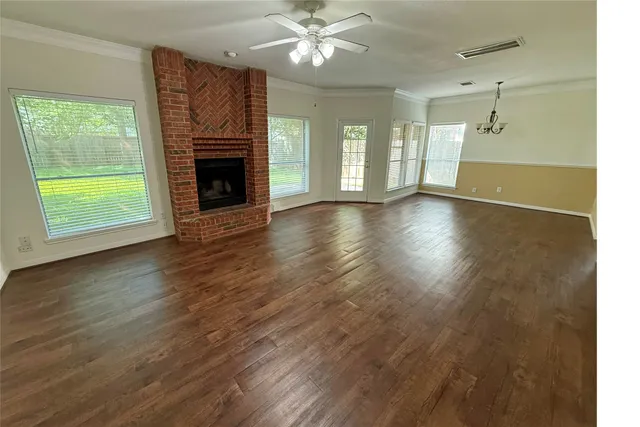 a kitchen with stainless steel appliances a stove a sink and a microwave