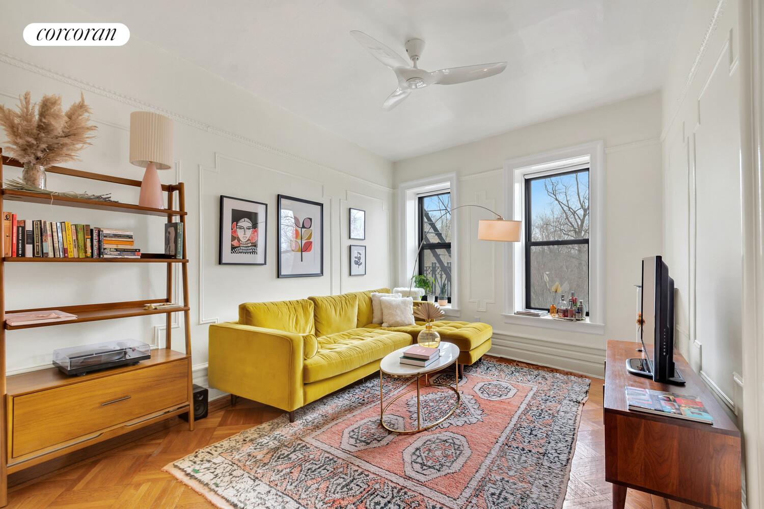 147 Prospect Park Southwest, Unit 11 Brooklyn, NY 11218 - Photo 2 of 9 a living room with furniture and a flat screen tv