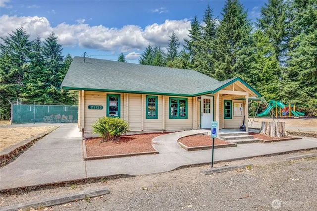 a house view with a sitting space and garden