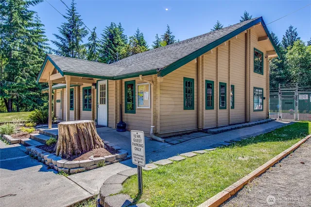 a view of a house with backyard porch and sitting area