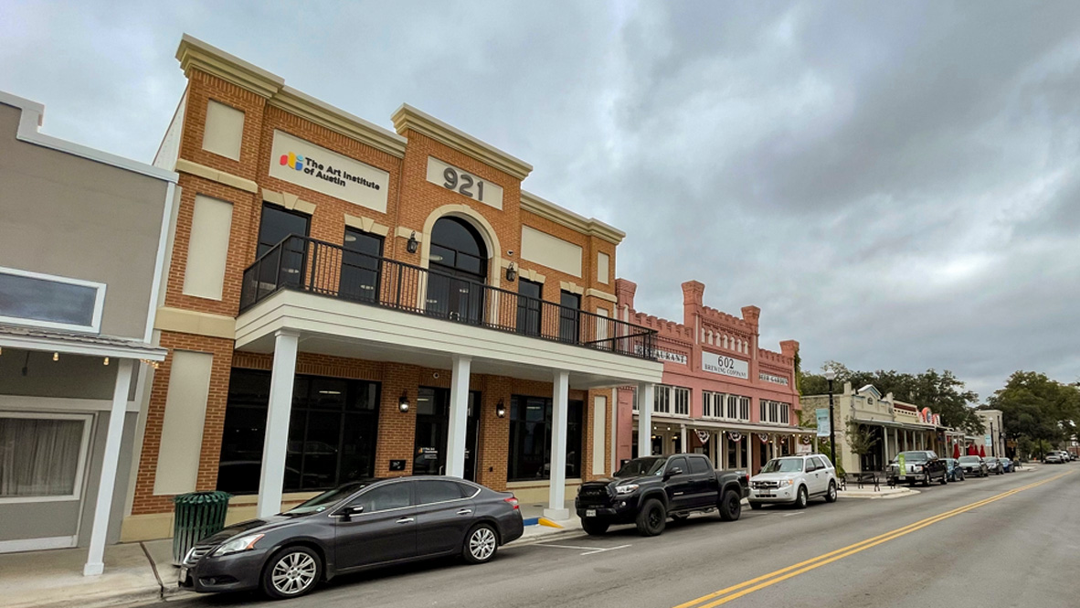 306 Constanza Trail Bastrop, TX 78602 - Photo 6 of 6 a car parked in front of a building