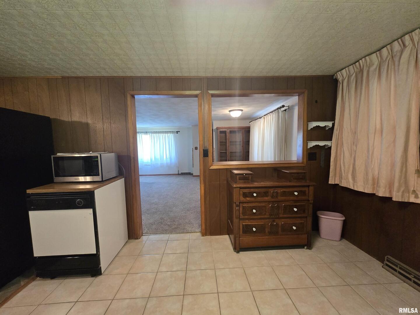507 South Church Street Albany, IL 61230 - Photo 3 of 15 a kitchen with a refrigerator and a sink