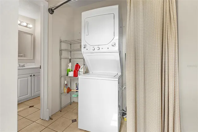 a bathroom with a toilet sink vanity and mirror