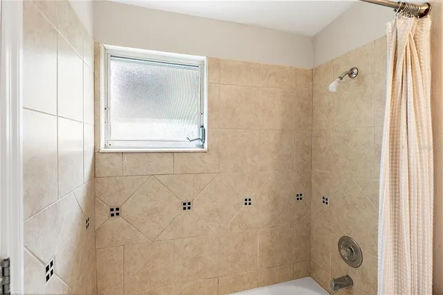 a view of a house with backyard and garden