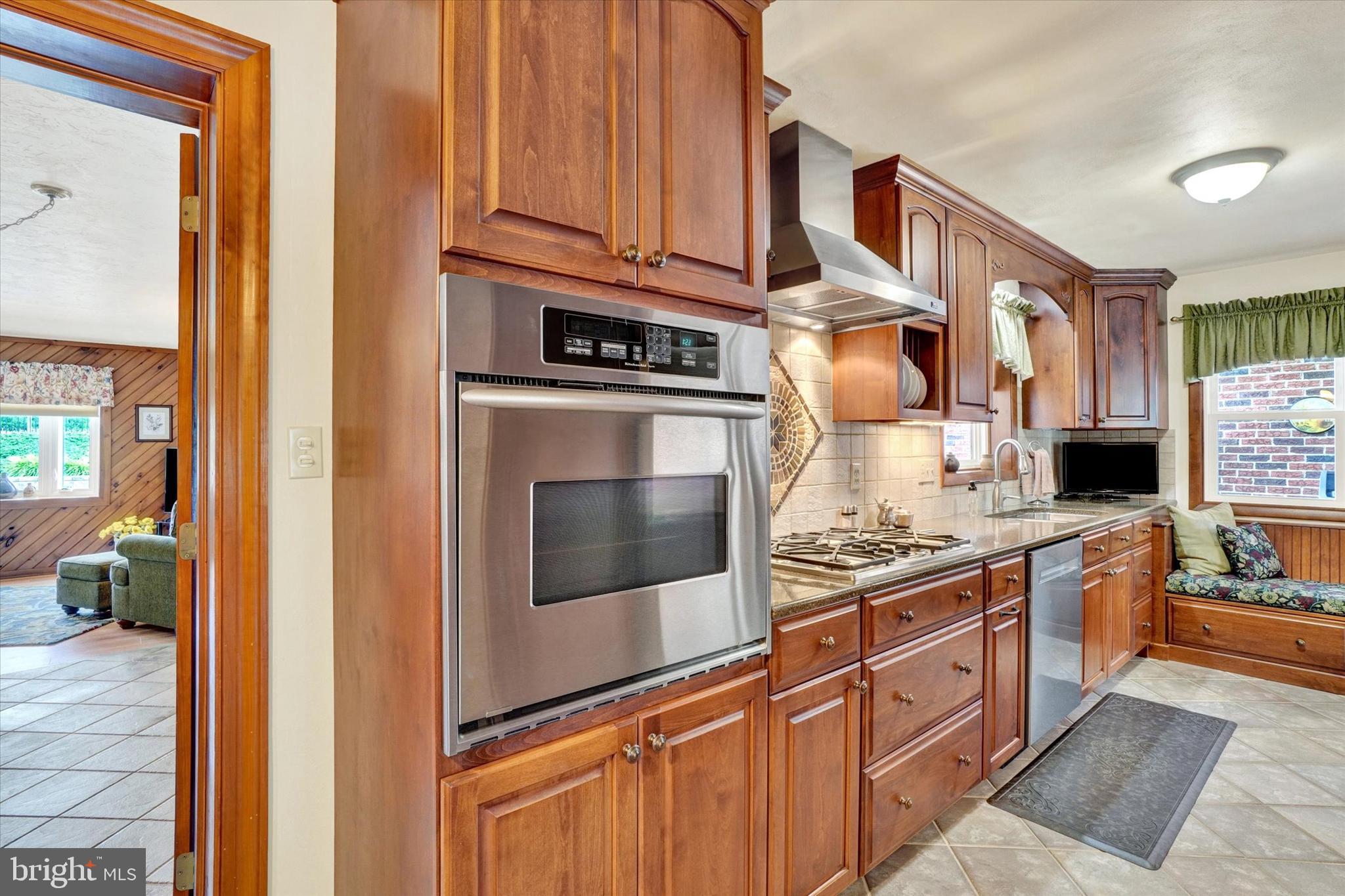 285 South Main Street Mount Wolf, PA 17347 - Photo 8 of 34 a kitchen with stainless steel appliances granite countertop a stove and cabinets