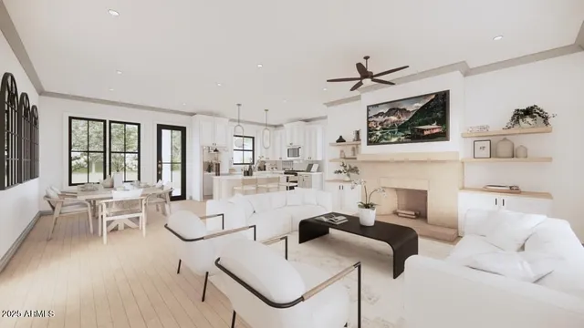 a living room with furniture a rug and white walls