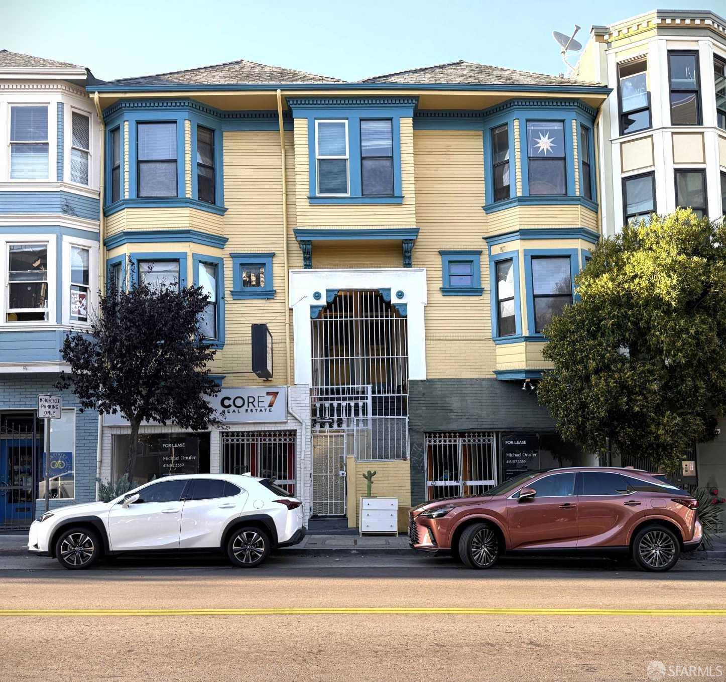 a front view of a house with parking space
