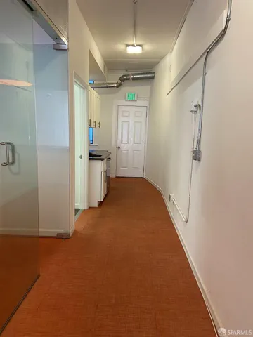 a view of a hallway to a room