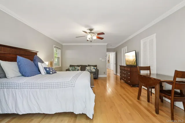 a bedroom with two beds and a couch