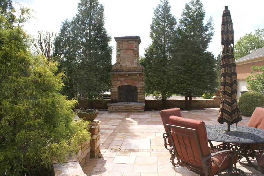 11363 Owens Chapel Road Springfield, TN 37172 - Photo 8 of 30 a view of a patio with couches fire pit and a table and chairs