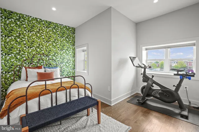 a bedroom with furniture and a window